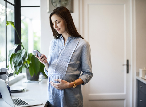 An expectant mother accessing resources from Optima Health.