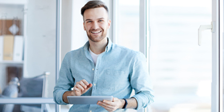 A business savvy man on a tablet