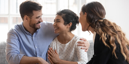 Broker working with happy couple