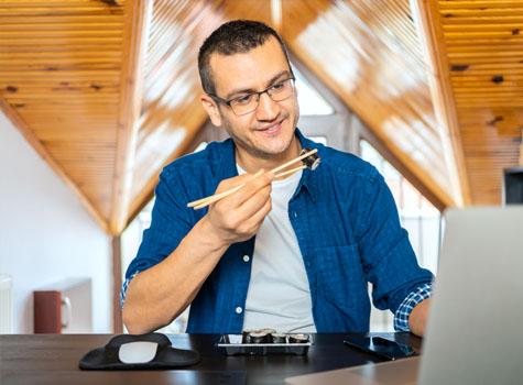 A saavy man watching healthy videos on his lunch break.