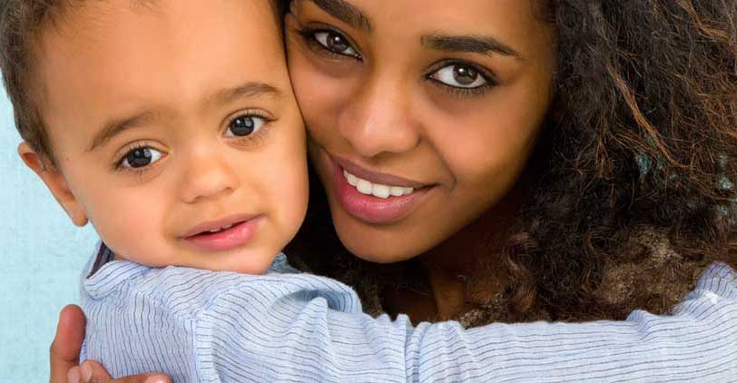 Mom and son smiling