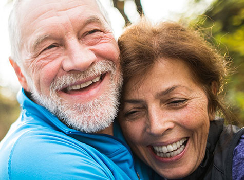 A mature couple embracing