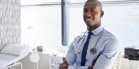 Doctor smiling in patient room